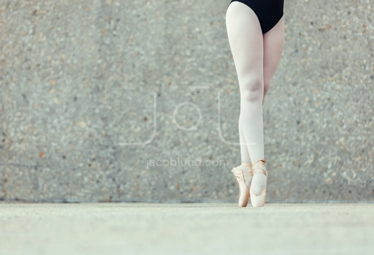 Close up of legs of ballet dancer standing on toes